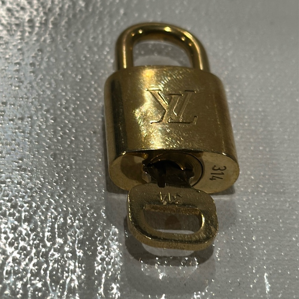 Louis Vuitton Authentic Vintage Lock and Key # 314.